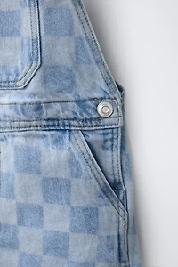 SALOPETTE COURTE EN JEAN À CARREAUX DAMIER