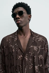 CHEMISE SEMI-TRANSPARENTE À PAILLETTES LIMITED EDITION