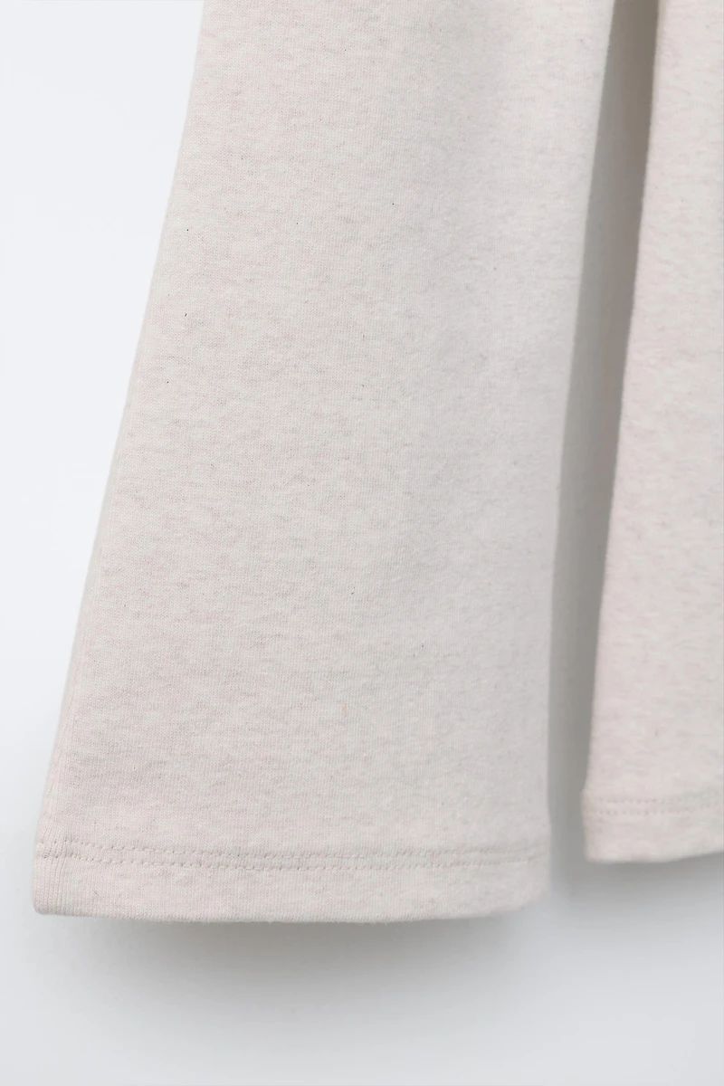 LEGGING FLARE INTERLOCK DÉCOR ÉTIQUETTE