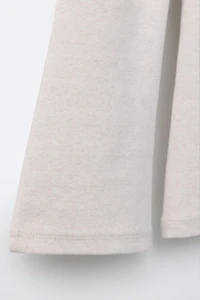 LEGGING FLARE INTERLOCK DÉCOR ÉTIQUETTE