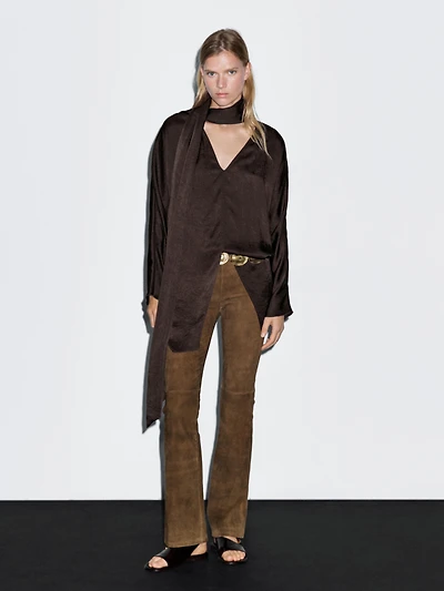 Long flowing blouse with tied neck