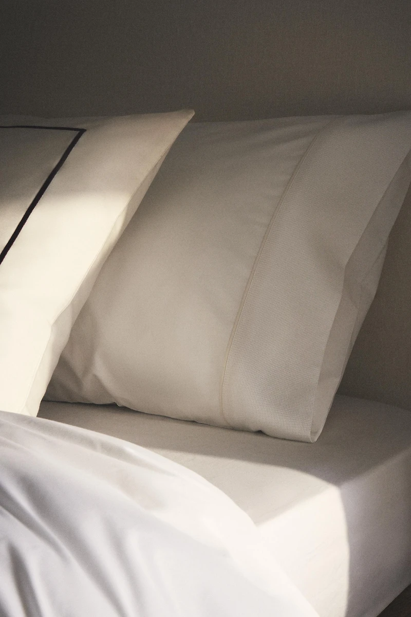 TAIE D’OREILLER PIQUÉ PASSEPOIL