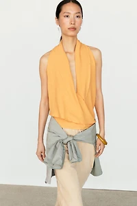 Flowing halter top with ruffle detail