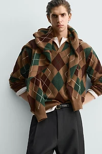 POLO EN MAILLE À LOSANGES 100 % LAINE