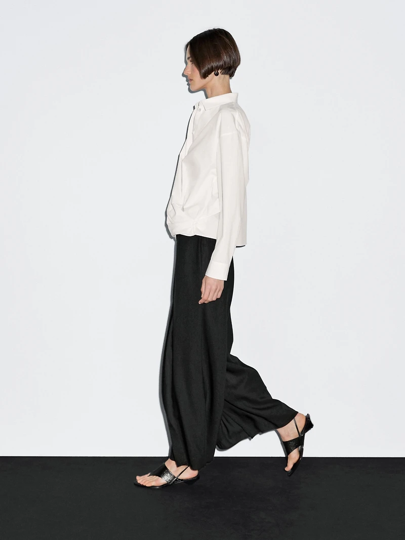 100% cotton shirt with draped asymmetric hem
