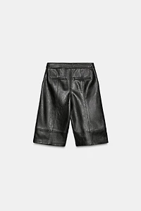 SHORT LONGUE MATIÈRE SYNTHÉTIQUE