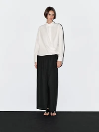 100% cotton shirt with draped asymmetric hem