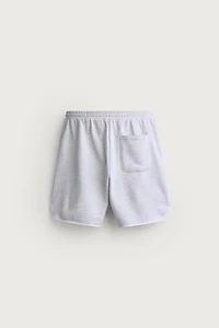 SHORT DE SURVÊTEMENT BRODÉ À PIÈCES