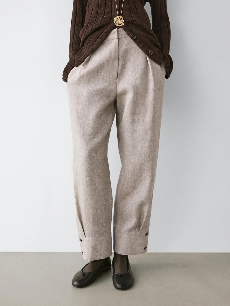 Suit trousers with buckle detail
