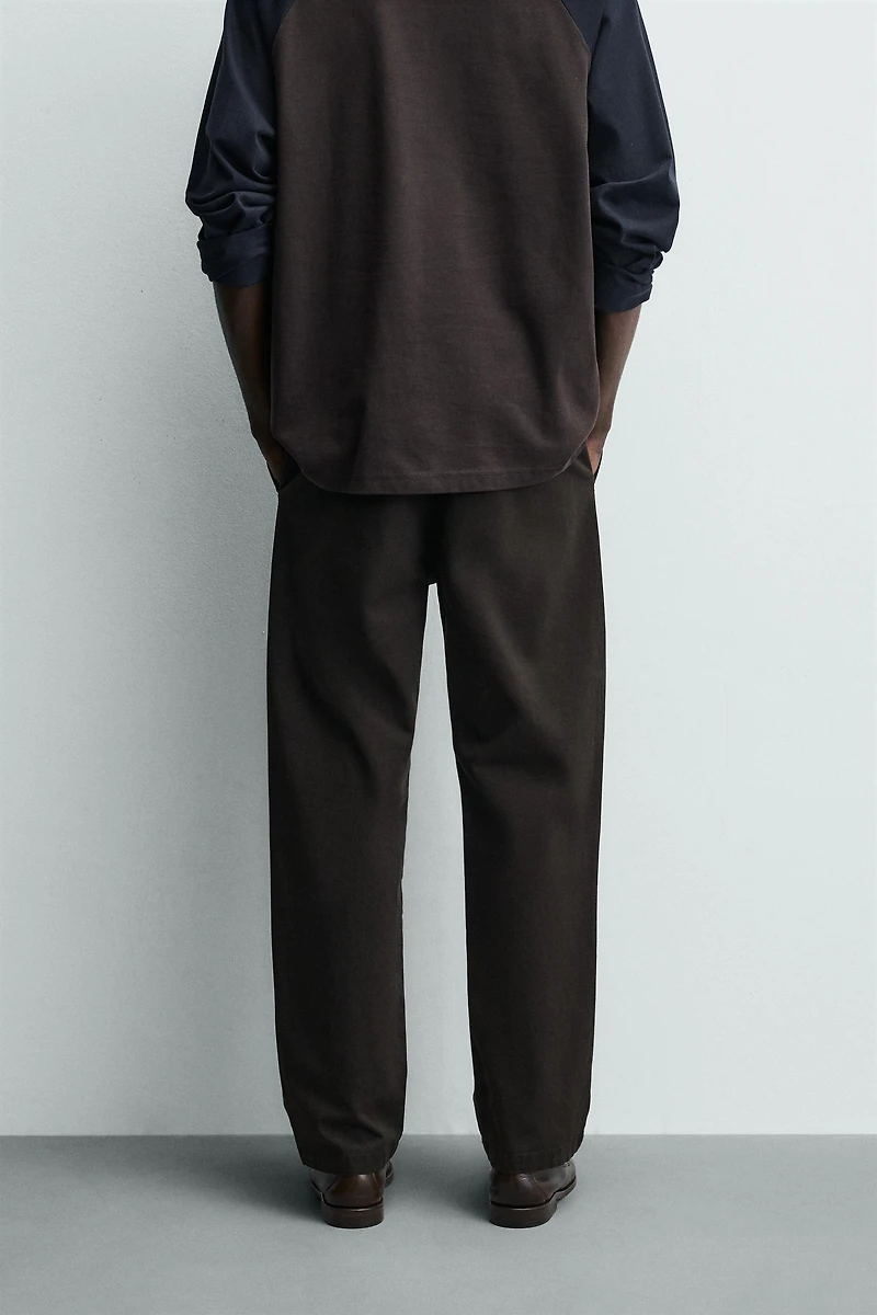 RELAXED FIT PLEATED PANTS