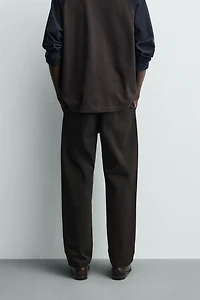 RELAXED FIT PLEATED PANTS