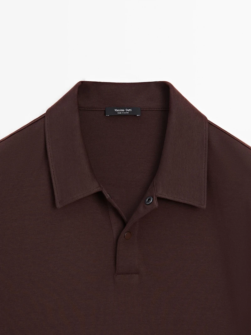 Short sleeve polo shirt with snap-button placket
