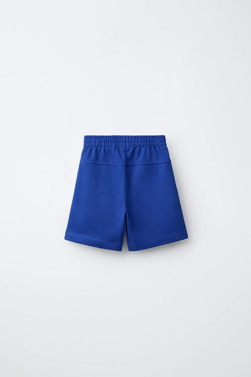 SHORT EN MOLLETON UNI