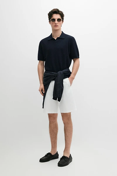 Polo en maille torsadée à col V
