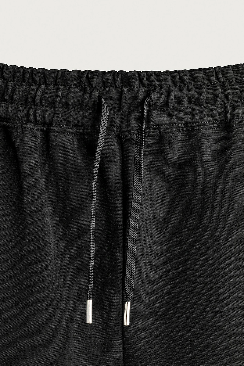 RELAXED FIT INTERLOCK TRACK SHORTS