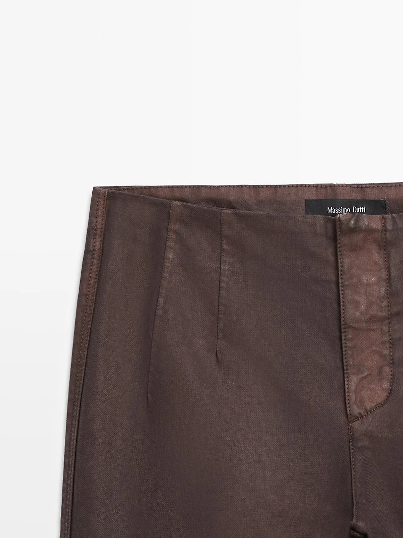Waxed flare fit trousers