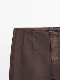 Waxed flare fit trousers