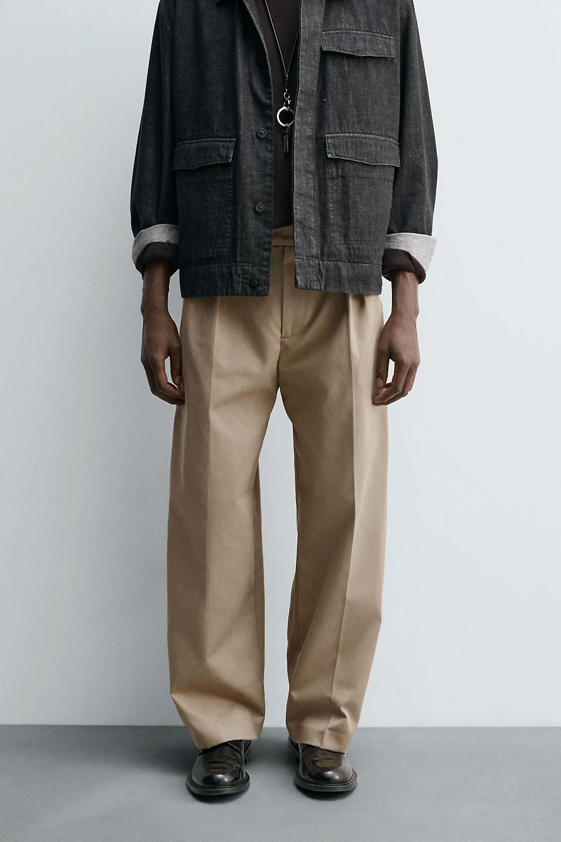 RELAXED FIT PLEATED PANTS
