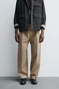 RELAXED FIT PLEATED PANTS