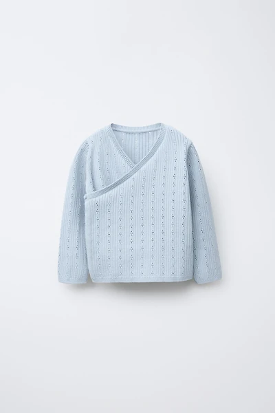 GILET EN MAILLE CROISÉ AJOURÉ