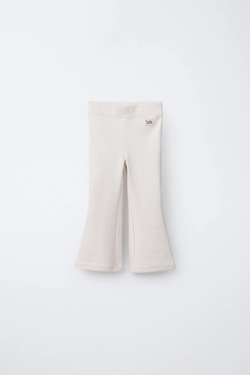 LABEL DETAIL INTERLOCK FLARE LEGGINGS