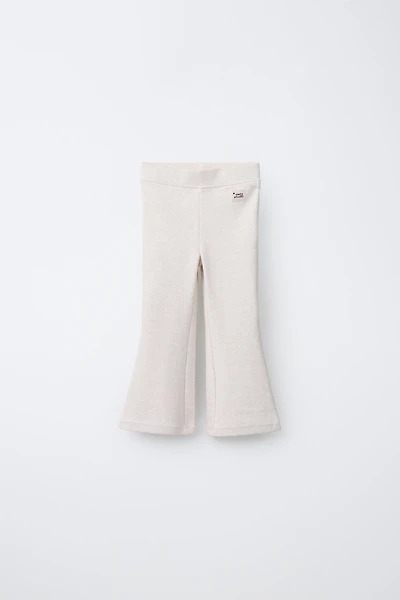 LABEL DETAIL INTERLOCK FLARE LEGGINGS