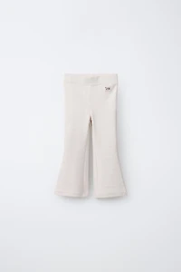 LABEL DETAIL INTERLOCK FLARE LEGGINGS