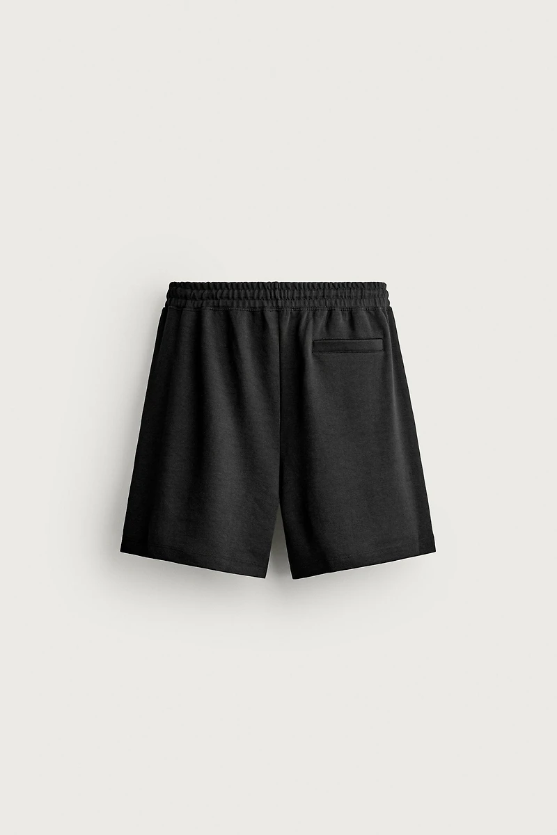 RELAXED FIT INTERLOCK TRACK SHORTS