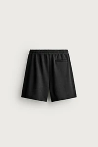 RELAXED FIT INTERLOCK TRACK SHORTS
