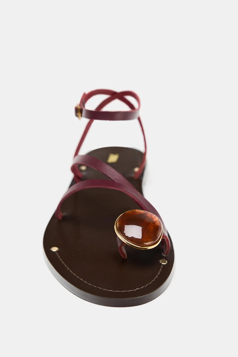 FLAT LEATHER SANDALS WITH DECORATIVE STRAPS