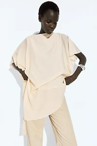 Asymmetric cape-style flowing blouse