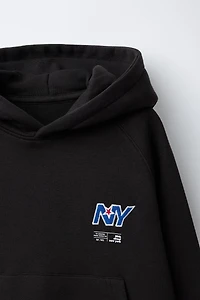 SWEAT POCHE BRODÉE