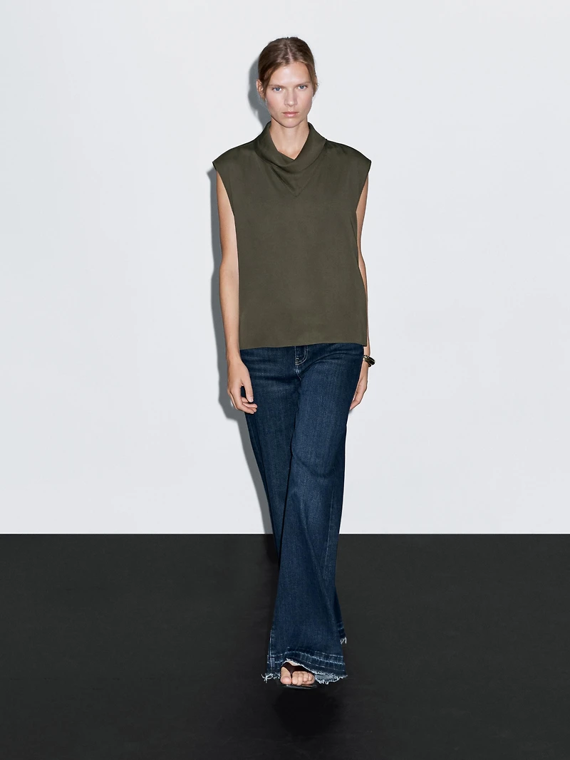Flowing blouse with draped neck detail
