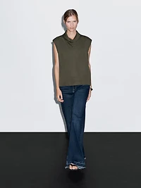 Flowing blouse with draped neck detail