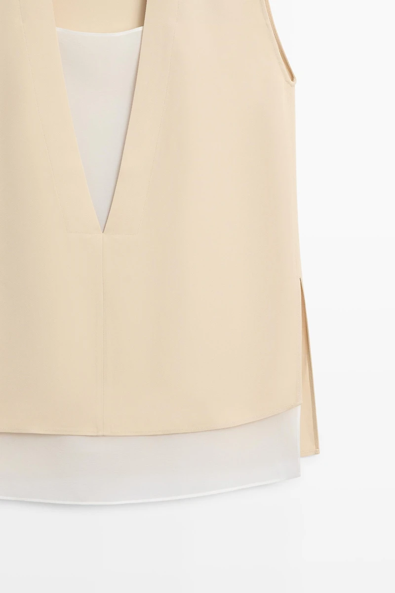 Flowing double-layer top with contrast detail