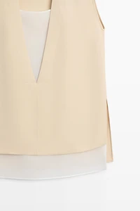 Flowing double-layer top with contrast detail