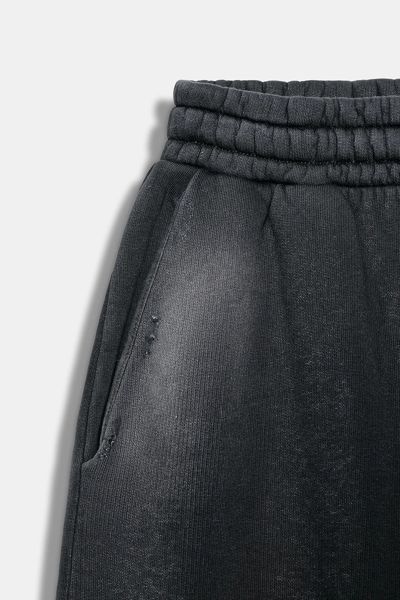 WASHED EFFECT RIPPED FLEECE PANTS
