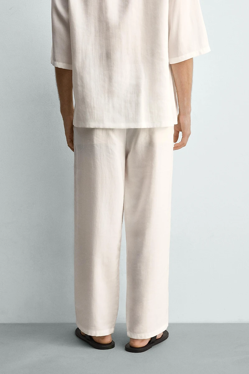 PANTALON FLUIDE À PLIS LATÉRAUX