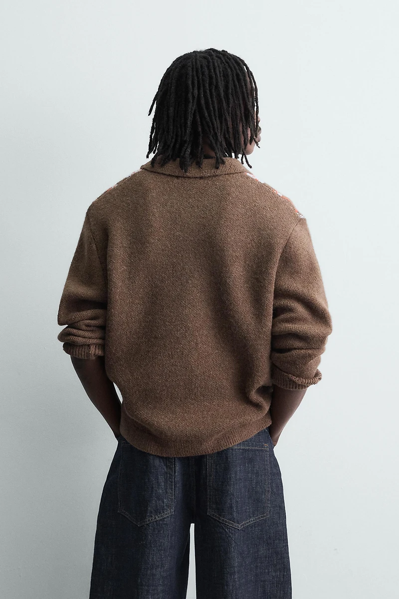 KNIT LOZENGE PATTERN POLO WITH DISTRESSED EFFECT