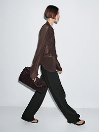Flowing bib-front shirt with ruffles