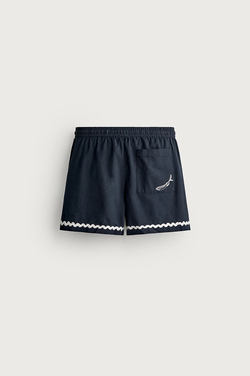 SHORT COURT BRODERIE POISSON