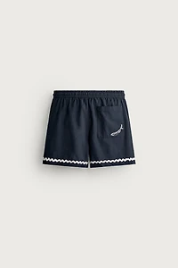 SHORT COURT BRODERIE POISSON