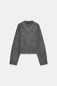 PULL EN MAILLE DOUX À BOUTONS