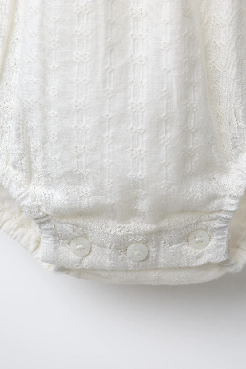 EMBROIDERED FAGOTING BODYSUIT