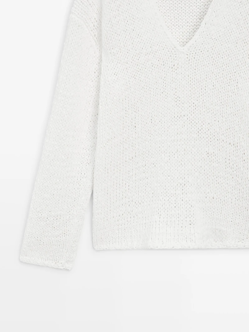 Pull maille ajourée col en V