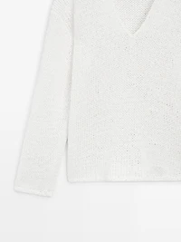 Pull maille ajourée col en V