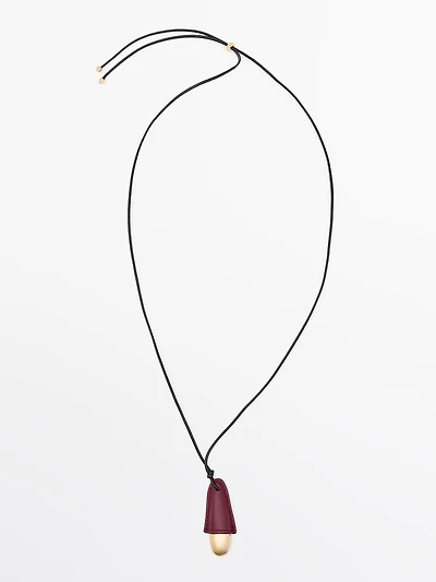 Pendentif pièce en cuir