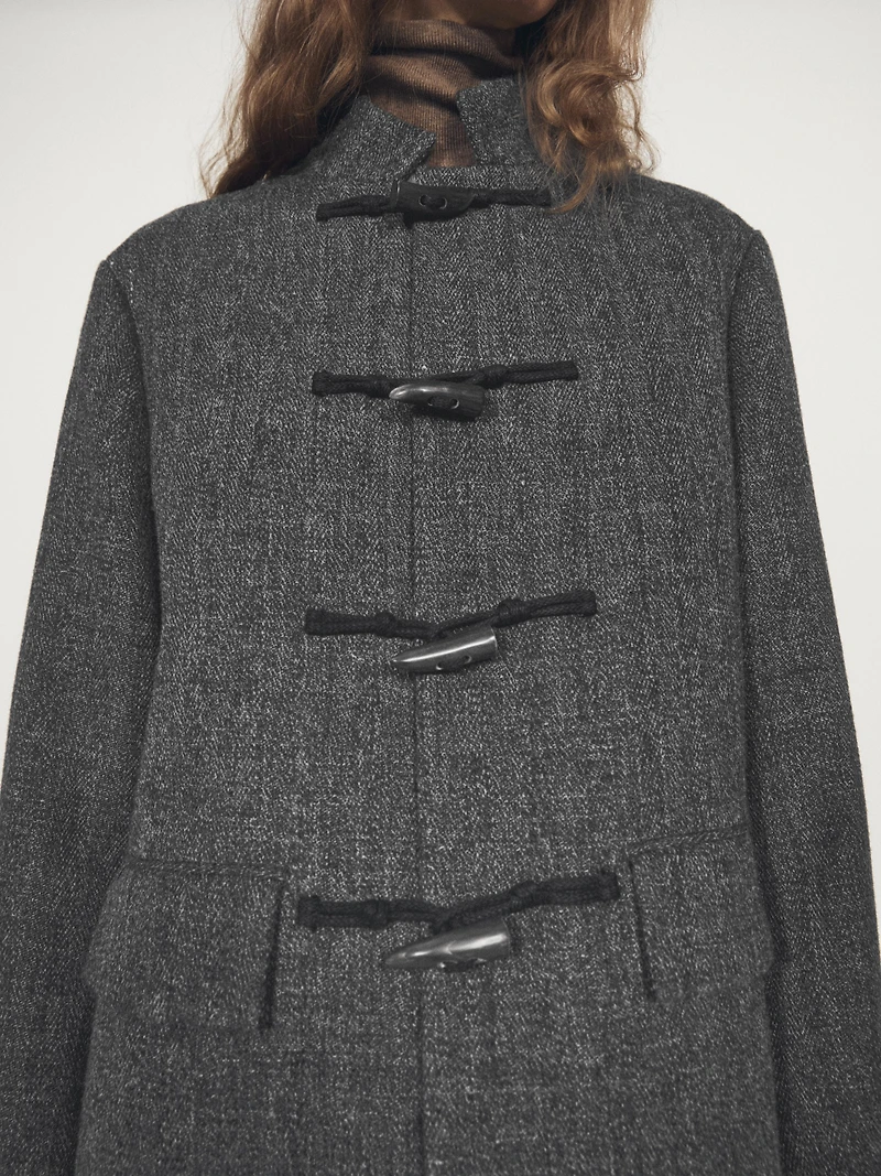 Mid-length coat with horn toggle