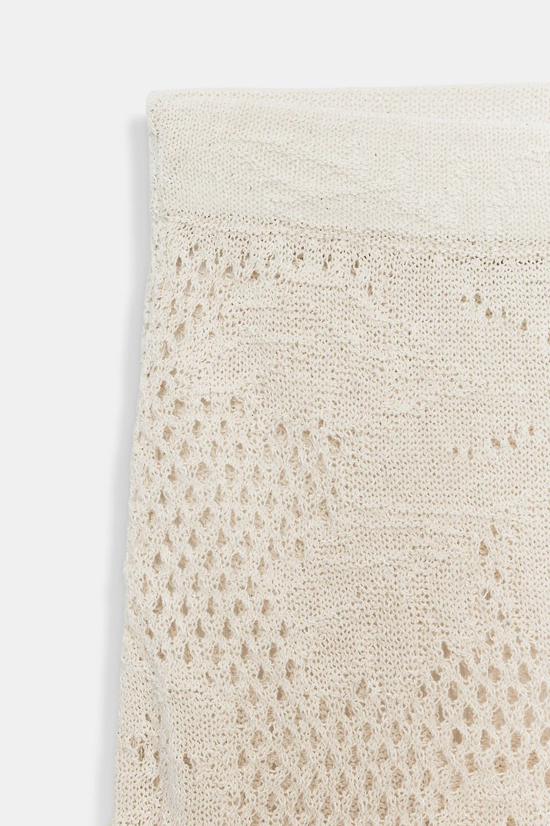 JUPE COURTE EN MAILLE POINTELLE