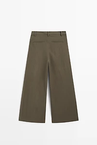 Technical wide-leg pleated pants